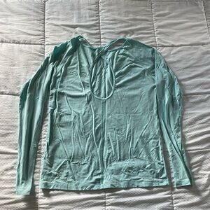 Aqua Under Armour long sleeve workout top with back cutout and thumb holes